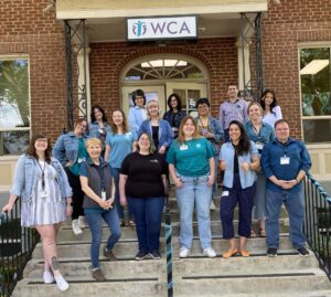 WCA staff gathered on the front steps wearing their best denim